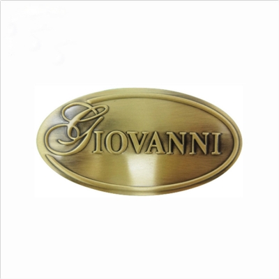 Embossed brass logo plate